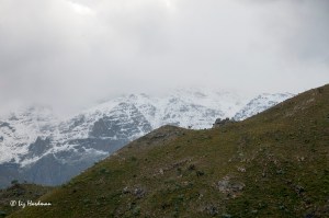 The rugged mountains of the Du Toitskloof are wreathed in swirling clouds and snowy drifts.