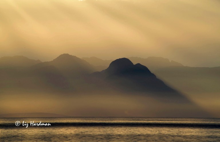 Golden sunrise over False Bay and Mountains